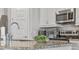 Granite countertops and stainless steel appliances add elegance to the well-equipped kitchen at 7759 Westland Dr, Kissimmee, FL 34747