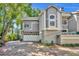 Charming two-story townhouse featuring an attached garage and mature landscaping at 796 Mcintyre Ave, Winter Park, FL 32789