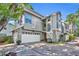 Stylish two-story townhouse showcasing a well-manicured yard and inviting curb appeal at 796 Mcintyre Ave, Winter Park, FL 32789