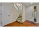Inviting foyer with hardwood floors, staircase and decorative stained glass window in the front door at 796 Mcintyre Ave, Winter Park, FL 32789