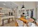 Bright kitchen and eat-in area with lovely cabinetry and ample natural light at 796 Mcintyre Ave, Winter Park, FL 32789