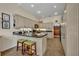 Bright kitchen features neutral cabinetry, granite countertops and modern appliances with tile floor at 796 Mcintyre Ave, Winter Park, FL 32789