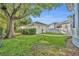 Spacious backyard featuring a shed, lush green lawn, and tidy landscaping at 821 Veranda Pl, Celebration, FL 34747
