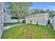 Green backyard with grassy lawn and a shed, great for outdoor activities at 821 Veranda Pl, Celebration, FL 34747