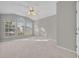 Spacious bedroom features plush carpet, ceiling fan, and large windows at 821 Veranda Pl, Celebration, FL 34747
