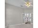 Bedroom with a ceiling fan with a light fixture and double doors at 821 Veranda Pl, Celebration, FL 34747