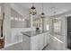 This kitchen features an island, granite countertops, and an open floorplan at 821 Veranda Pl, Celebration, FL 34747