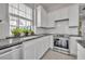 This kitchen features granite countertops, tile backsplash, and stainless oven at 821 Veranda Pl, Celebration, FL 34747