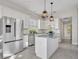 This kitchen features an island, stainless appliances, and pendant lighting at 821 Veranda Pl, Celebration, FL 34747