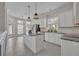 Spacious kitchen featuring an island, granite countertops, and breakfast nook at 821 Veranda Pl, Celebration, FL 34747