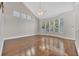 Bright living room featuring vaulted ceiling, hardwood floors, and large windows at 821 Veranda Pl, Celebration, FL 34747
