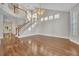 Bright, open living room boasts hardwood floors, vaulted ceiling, and staircase to the second floor at 821 Veranda Pl, Celebration, FL 34747