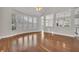 Sun-filled living room featuring vaulted ceiling, hardwood floors, and open layout at 821 Veranda Pl, Celebration, FL 34747