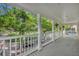 Inviting porch with white columns and railings, perfect for enjoying the outdoors at 821 Veranda Pl, Celebration, FL 34747