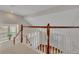 Open staircase with wooden banister overlooking hardwood floors below at 821 Veranda Pl, Celebration, FL 34747