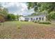 The home features a large backyard and sunroom, with lush landscaping at 8506 Shady Glen Dr, Orlando, FL 32819