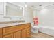Traditional bathroom with wood vanity, granite counters, and a shower-tub combination at 8506 Shady Glen Dr, Orlando, FL 32819
