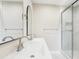 Contemporary bathroom features double sinks with marble countertops and a sleek glass shower at 8506 Shady Glen Dr, Orlando, FL 32819