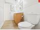 Bright bathroom featuring a wood vanity and modern fixtures, offering a comfortable space at 8506 Shady Glen Dr, Orlando, FL 32819
