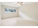 Bright bedroom with a large window and tile flooring at 8506 Shady Glen Dr, Orlando, FL 32819