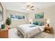 Cozy bedroom featuring a stylish rug, ceiling fan, and natural light at 8506 Shady Glen Dr, Orlando, FL 32819
