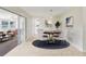 Dining area with sliding doors, modern lighting, and seamless flow to the kitchen at 8506 Shady Glen Dr, Orlando, FL 32819