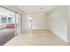 Dining area with sliding doors, modern lighting, and seamless flow to the kitchen at 8506 Shady Glen Dr, Orlando, FL 32819