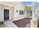The entrance features a black door, sidelights, and detailed landscaping at 8506 Shady Glen Dr, Orlando, FL 32819
