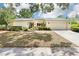 Charming single-story home with manicured landscaping and a welcoming two-car garage at 8506 Shady Glen Dr, Orlando, FL 32819