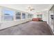 Spacious Florida room offering natural light from numerous windows, ceiling fans and access to outdoors at 8506 Shady Glen Dr, Orlando, FL 32819