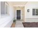 View of the front entryway featuring sidelights and a black front door at 8506 Shady Glen Dr, Orlando, FL 32819