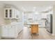 Spacious kitchen boasts ample counter space, stainless steel appliances, and wood-look tile floors at 8506 Shady Glen Dr, Orlando, FL 32819