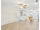 Open-concept kitchen featuring white cabinets, center island, and stainless steel appliances at 8506 Shady Glen Dr, Orlando, FL 32819