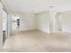 Bright living area with tile floors, neutral walls, and access to the kitchen at 8506 Shady Glen Dr, Orlando, FL 32819