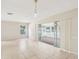 Bright living room with tile flooring and sliding glass doors leading to outdoor space at 8506 Shady Glen Dr, Orlando, FL 32819