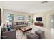 Comfortable living room featuring plush seating, natural light, and stylish decor at 8506 Shady Glen Dr, Orlando, FL 32819