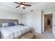 Comfortable bedroom featuring tray ceilings, neutral colors, and a cozy atmosphere at 8643 Coventry Park Way, Windermere, FL 34786