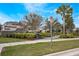 Stone sign at Windermere Trails neighborhood entrance with lush landscaping and sidewalks at 8643 Coventry Park Way, Windermere, FL 34786