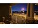 Charming porch view of lake with gorgeous fireworks display on a lovely night in the neighborhood at 8643 Coventry Park Way, Windermere, FL 34786