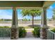 Beautiful exterior view from a covered porch overlooking the scenic lake and community at 8643 Coventry Park Way, Windermere, FL 34786