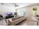 Bright living room with a comfortable couch, neutral walls, and large windows for natural light at 8643 Coventry Park Way, Windermere, FL 34786