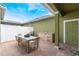 Outdoor patio with a dining table, chairs, a built-in grill, and a sink for entertaining at 8643 Coventry Park Way, Windermere, FL 34786
