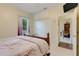 Comfortable bedroom with a double closet and an ensuite office space at 89 Pine Forest Ln, Haines City, FL 33844