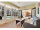 Enclosed sunroom with direct access to the pool and kitchen at 89 Pine Forest Ln, Haines City, FL 33844