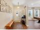 Welcoming home foyer with wood floors, front door with glass insert, and interior views at 89 Pine Forest Ln, Haines City, FL 33844