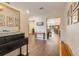 Inviting home foyer with wood floors, high ceilings and views to the kitchen and dining areas at 89 Pine Forest Ln, Haines City, FL 33844