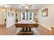 Spacious game room featuring a pool table, ceiling fan, and large window with natural light at 89 Pine Forest Ln, Haines City, FL 33844