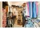 A functional walk-in closet with shelving and hanging rods for ample storage space at 89 Pine Forest Ln, Haines City, FL 33844