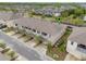 Beautiful townhomes in a well-maintained community with lush landscaping and a pond view at 9433 Randal Park Blvd, Orlando, FL 32832