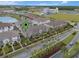 An aerial view shows the home, the neighborhood, and the surrounding ponds and nearby businesses at 9433 Randal Park Blvd, Orlando, FL 32832